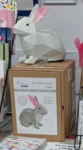 Assembled rabbit craft kit sitting on its box